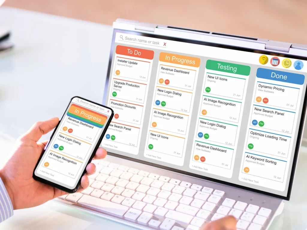 A automation workflow shown on a laptop and mobile showing tasks being automatically completed